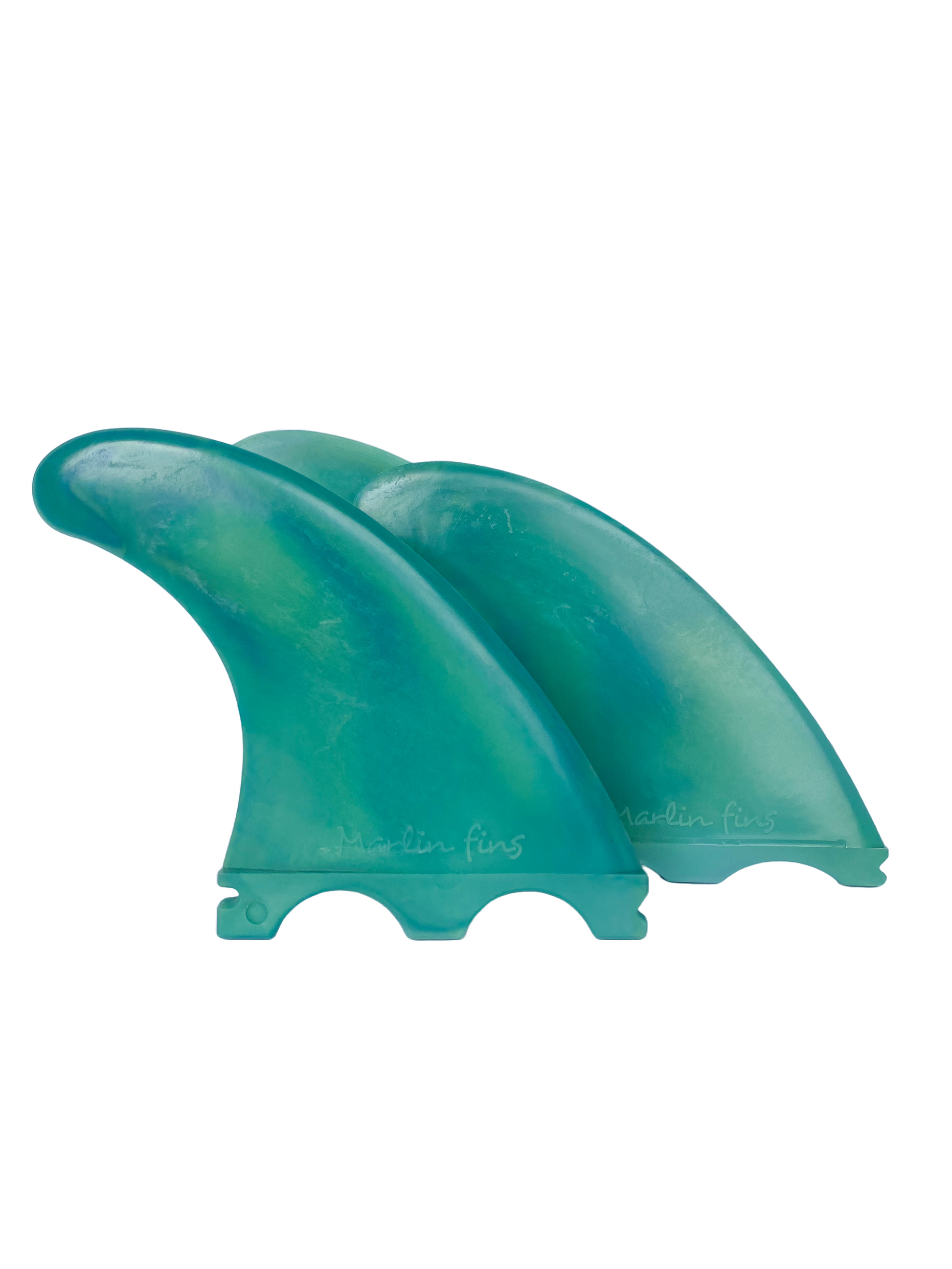 A set of green Futures thruster surfboard fins made from recycled plastic by Marlin Fins.