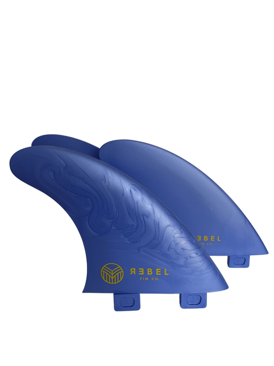 Set of FCS1 thruster surf fins in blue made by Rebel Fin Co.